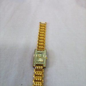 EJ Fashion Gold Tone with Rhinestones quart watch. Still has plastic on the back